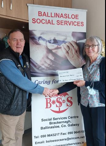 Joe Kelly Senior presents the proceeds of this 70th Birthday Fundraiser to Anne Marie Moran - Staff Member 