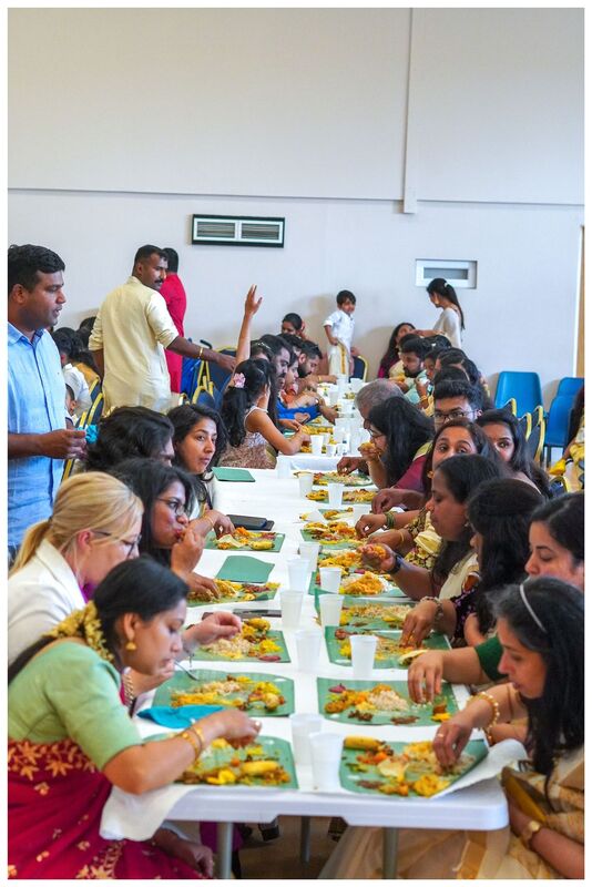 Attendees enjoying the Onam Sadhya feast.
