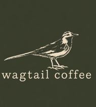 The logo of Wagtail coffee. It shows a wagtail bird against a dark green background. 