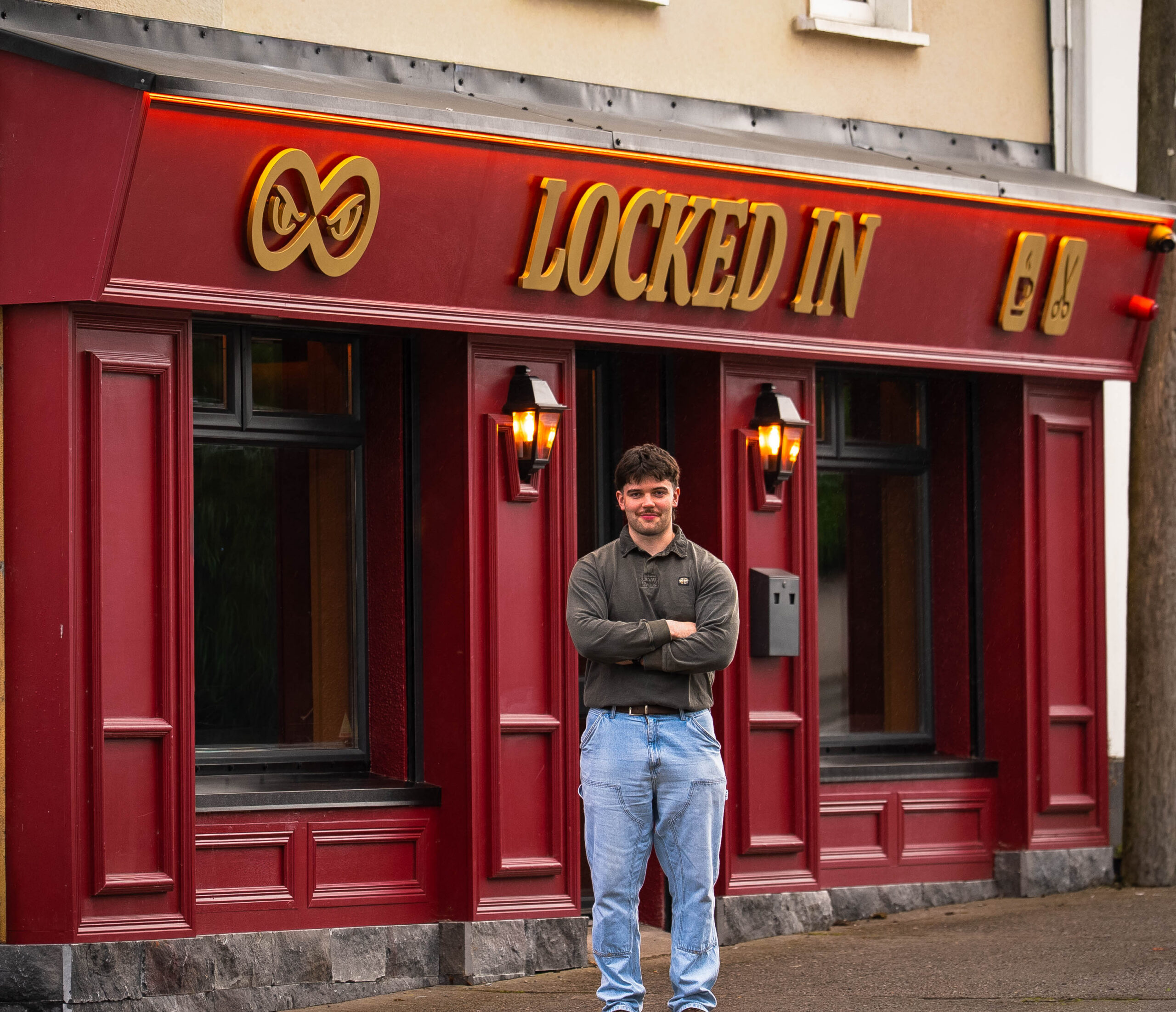 Kyle Blackweir, owner of Locked In, stands outside his new business.